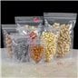 Línea de bolsas doypack transparentes en distintas medidas, cargadas con frutos secos y golosinas