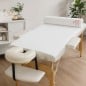 Papel sulfito blanco de 60 cm usado como papel camilla económico en camilla de estética